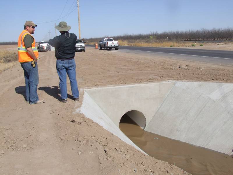 Men Near The Water Sewage — El Paso, TX — Aquatech Septic & Underground, LLC