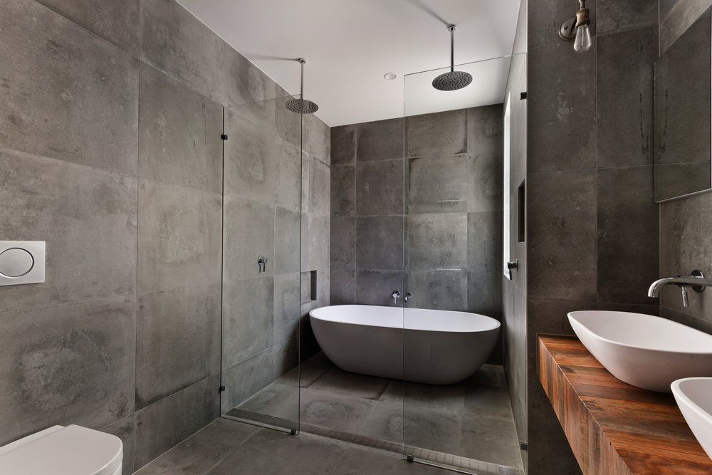 Modern Grey Tiled Bathroom — Renovation Services in Tamworth, NSW