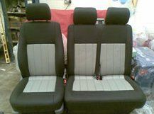 Three car seats in black and grey with identical upholstering.