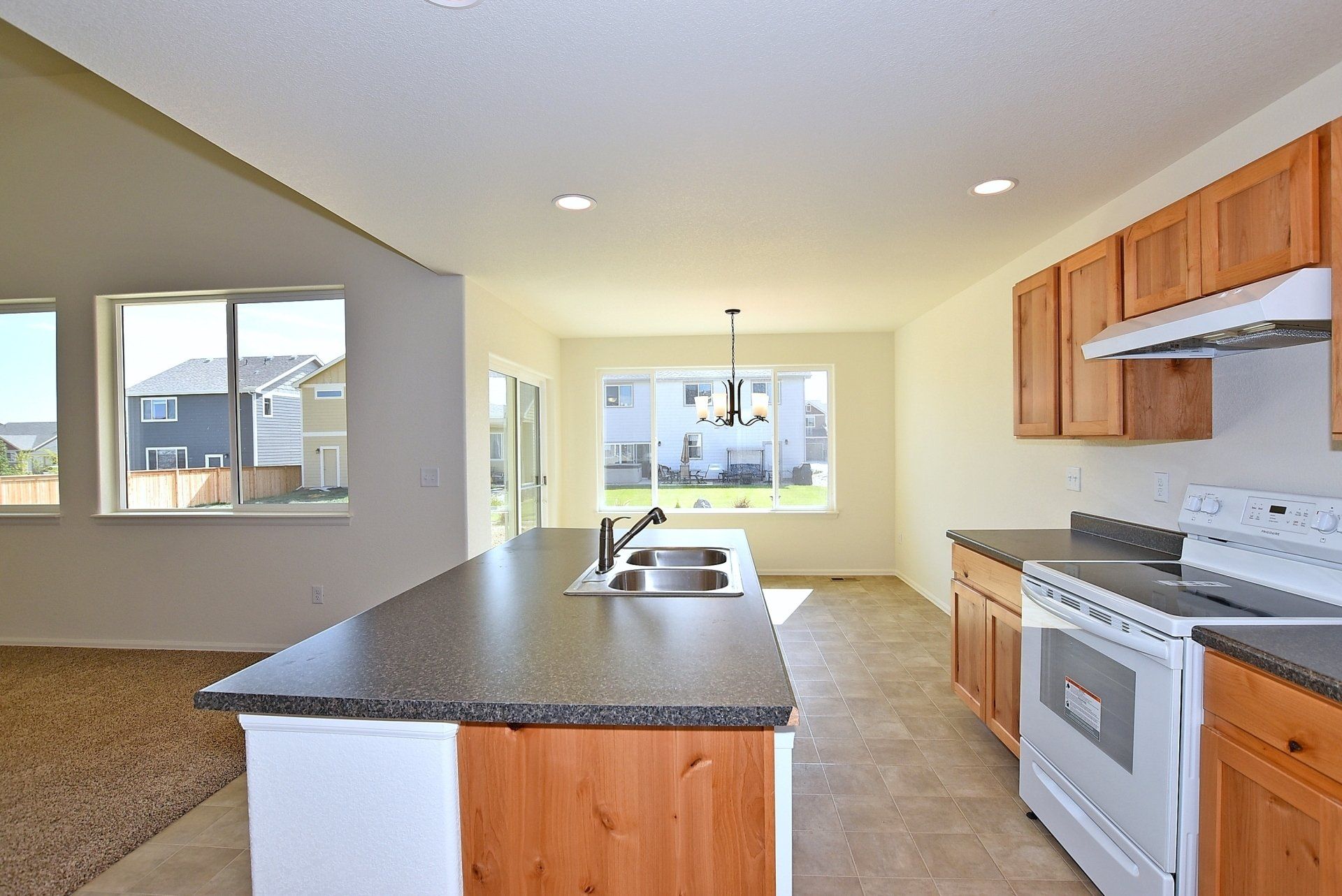 Kitchen with countertop, sink and window