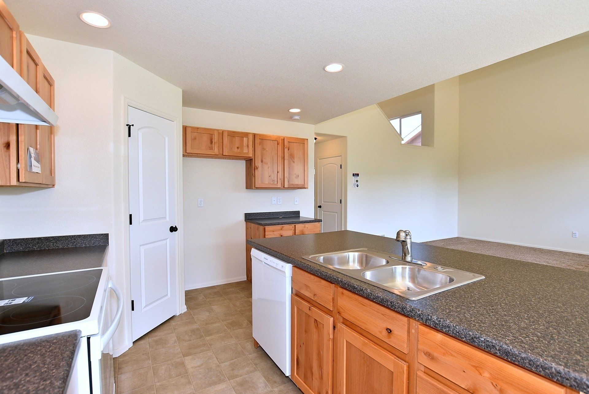 Kitchen with countertop, sink and tile floors