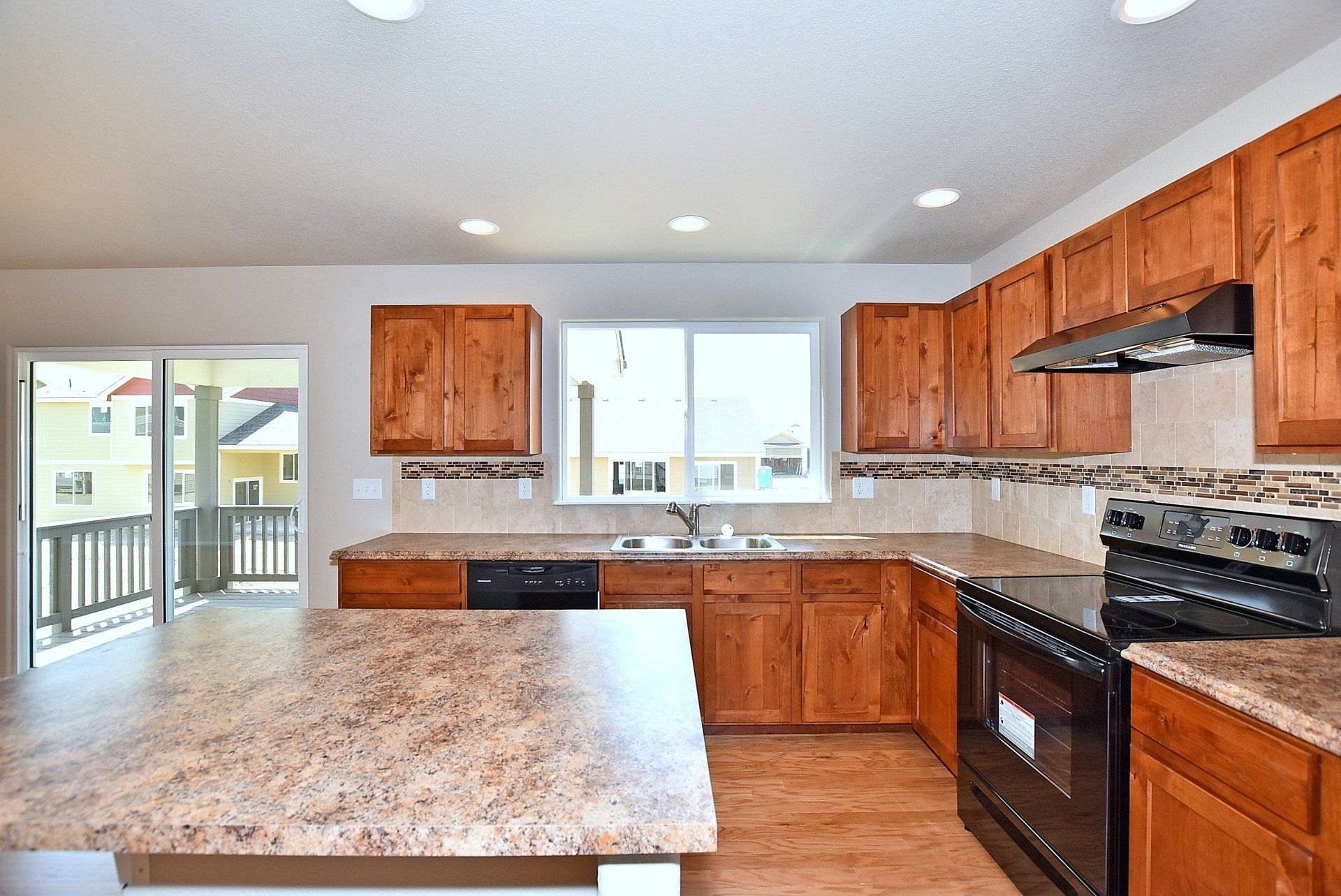 Kitchen with wood floors and granite countertops