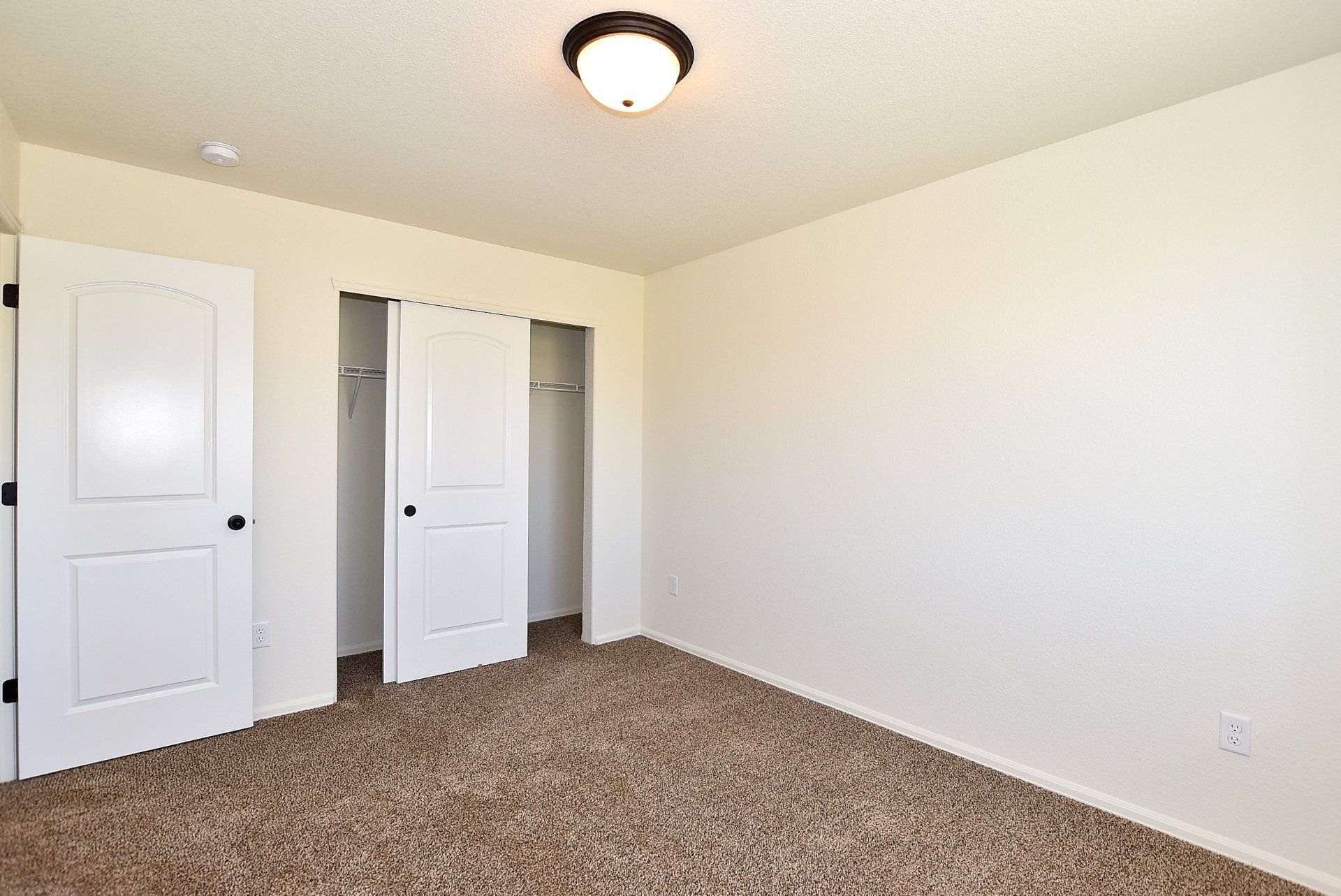 Room with sliding door closet