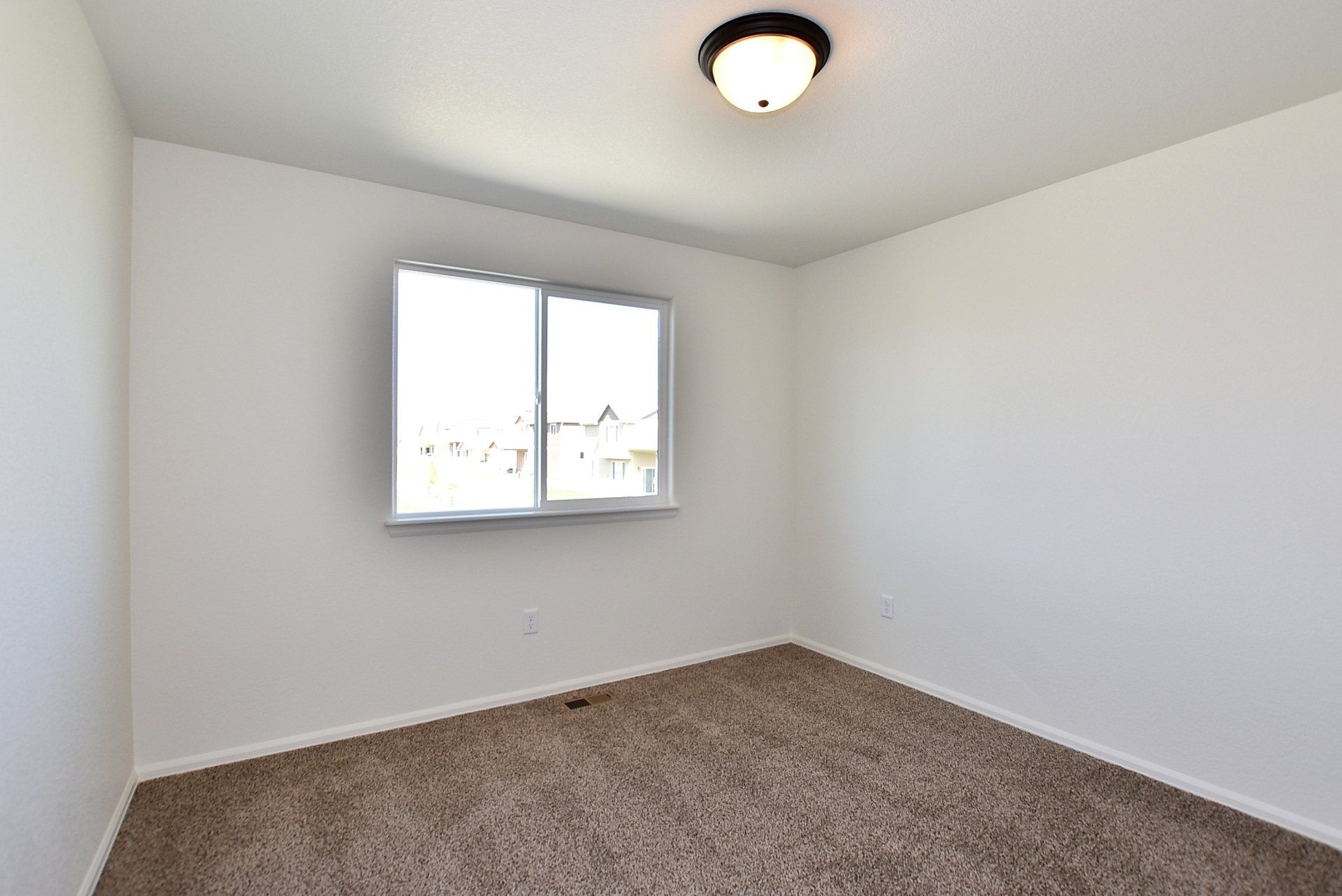 Bathroom with carpet flooring and window