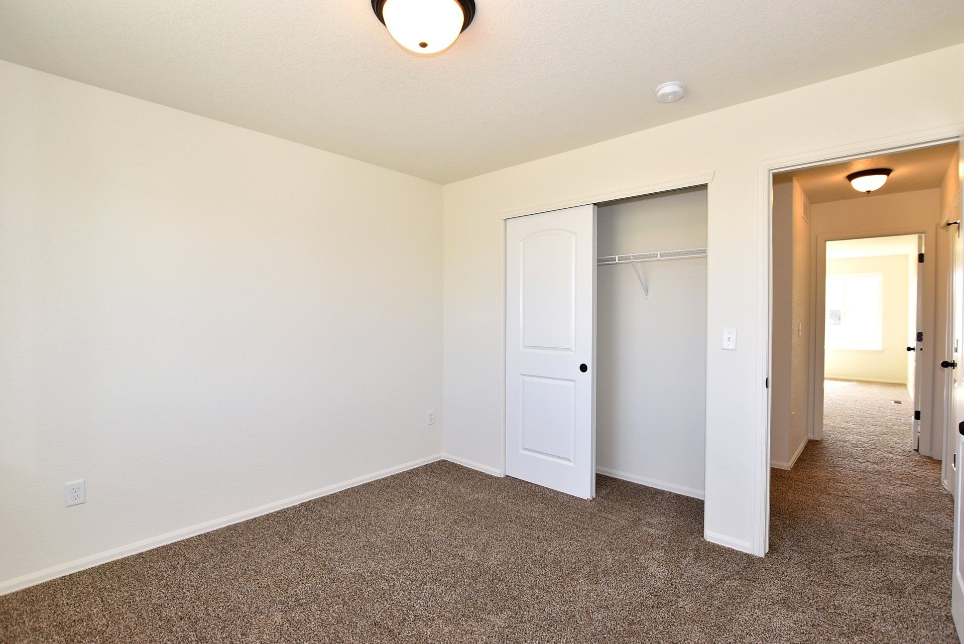 Bathroom with carpet flooring and closet