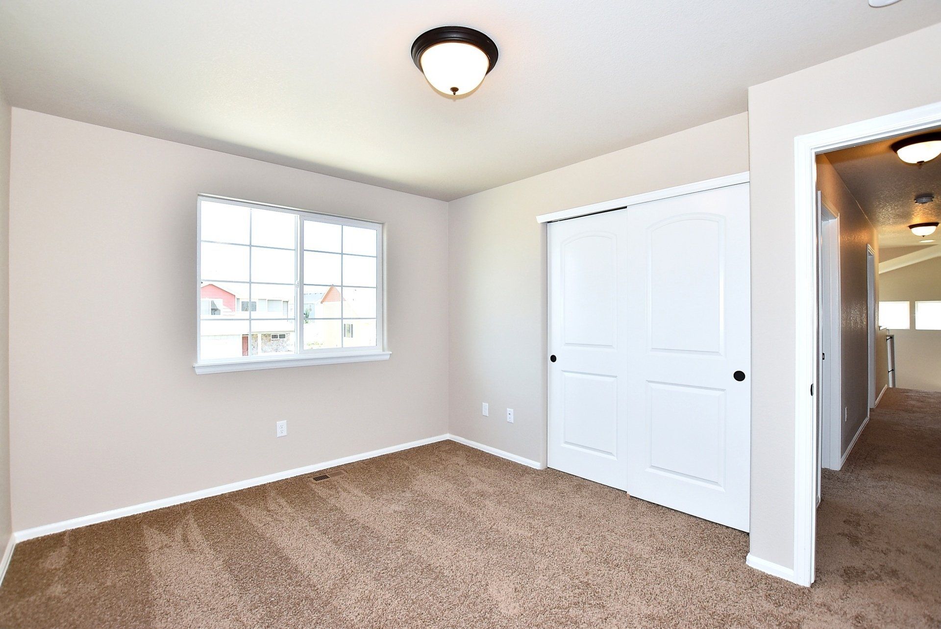 Bedroom with closet and hallway