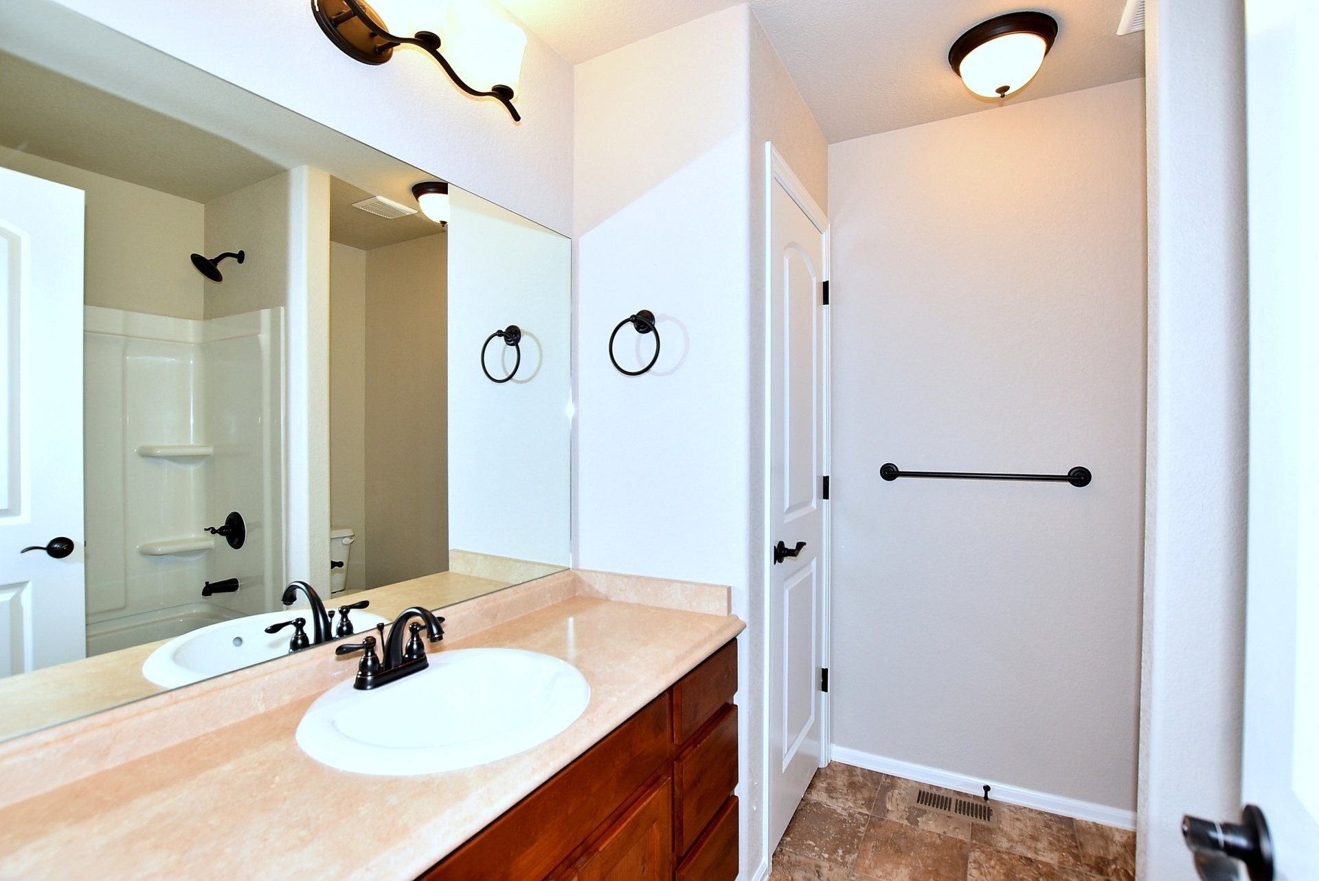 Bathroom with sink and wooden cabinets