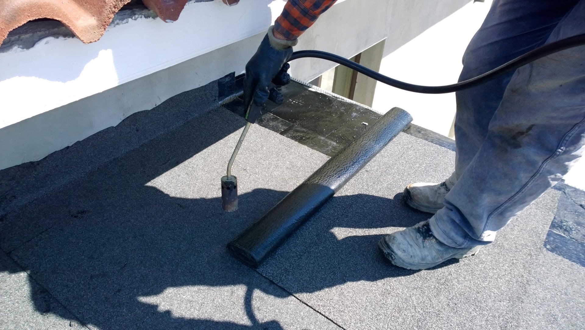 Flat roof being repaired