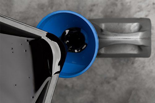 Pouring Oil Waste To Container