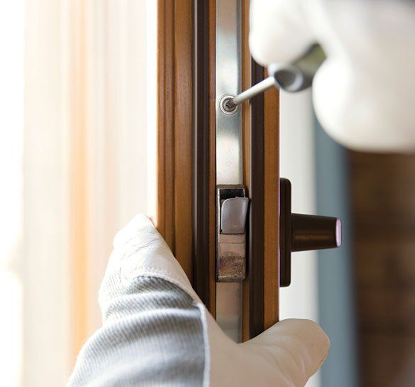 Fixing Door Lock — Windham, ME — Superior Lock & Key Inc. Fixing Door Lock — Windham, ME — Superior Lock & Key Inc.