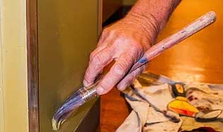 man painting a wall