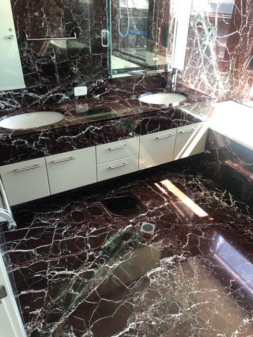 Shiny Marble Floor On The Bathroom — Total Sealing Works Whitsundays in Cannonvale, QLD