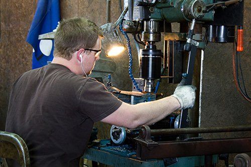 Basic Machining's staff metal tapping.