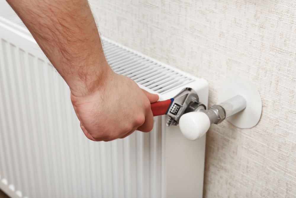a professional fixing a water heater