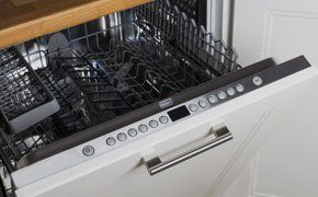 A washing machine with concealed controls