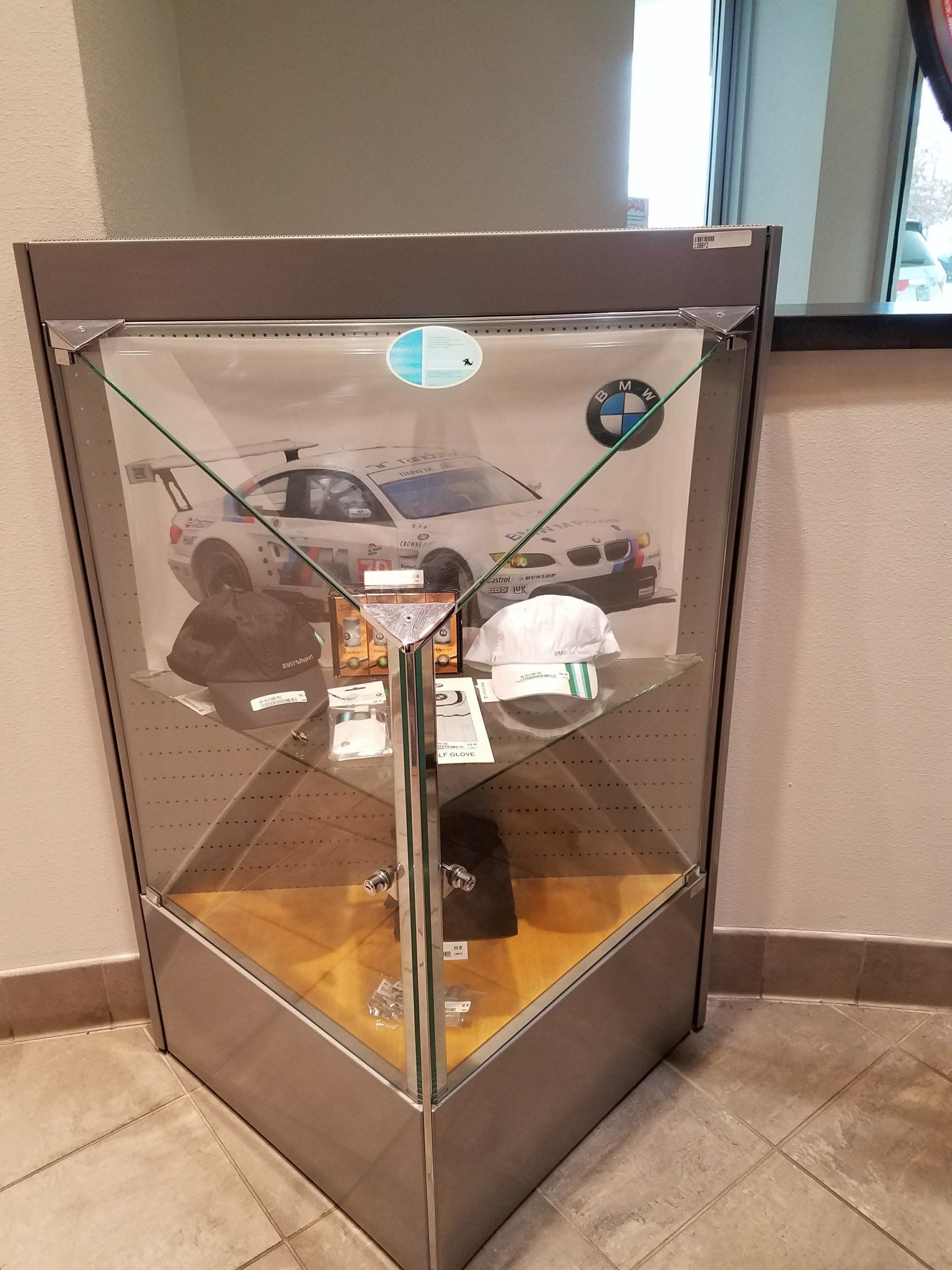A glass display case with a picture of a car on it