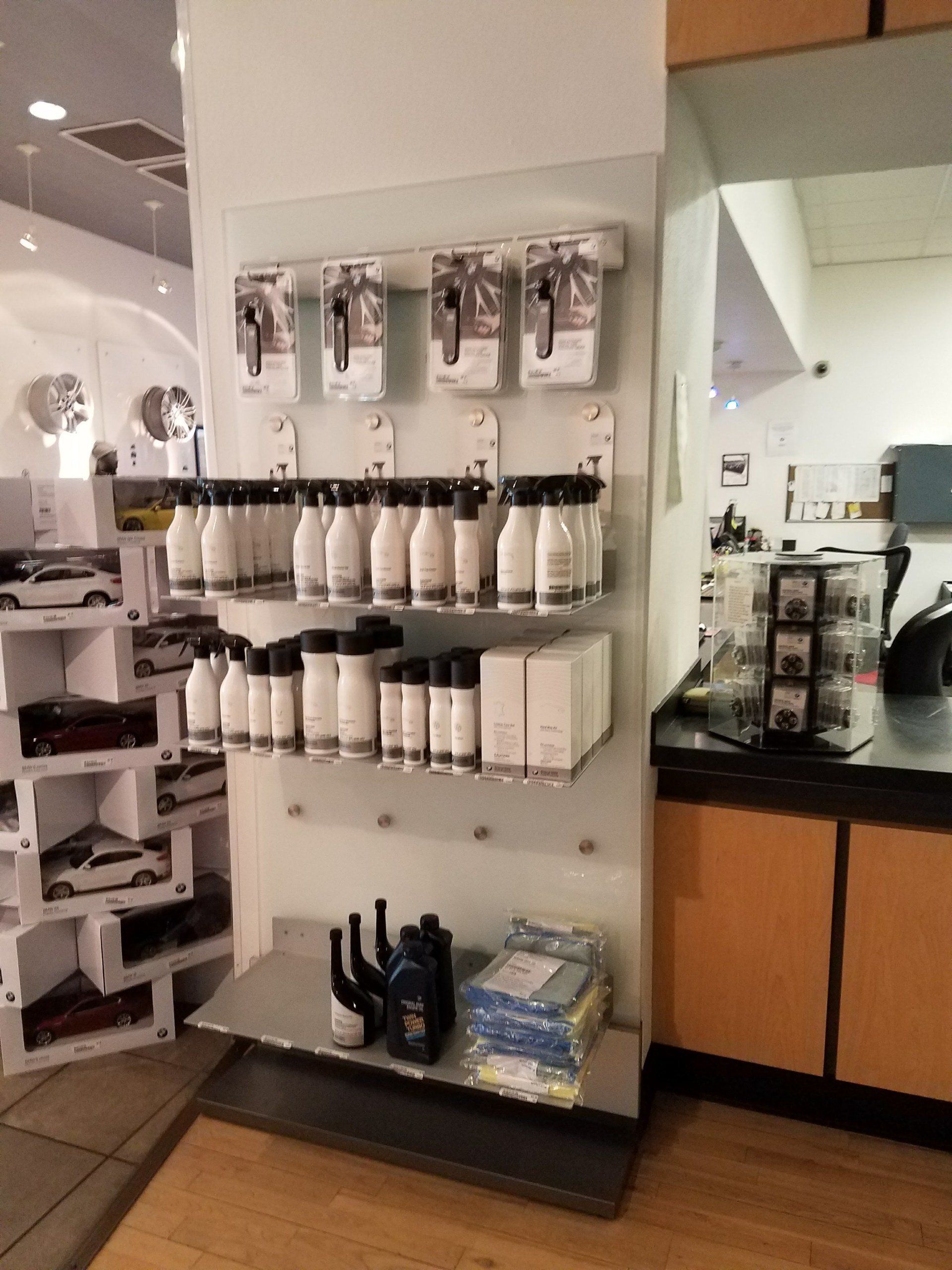 A display of hair products in a store with a counter in the background