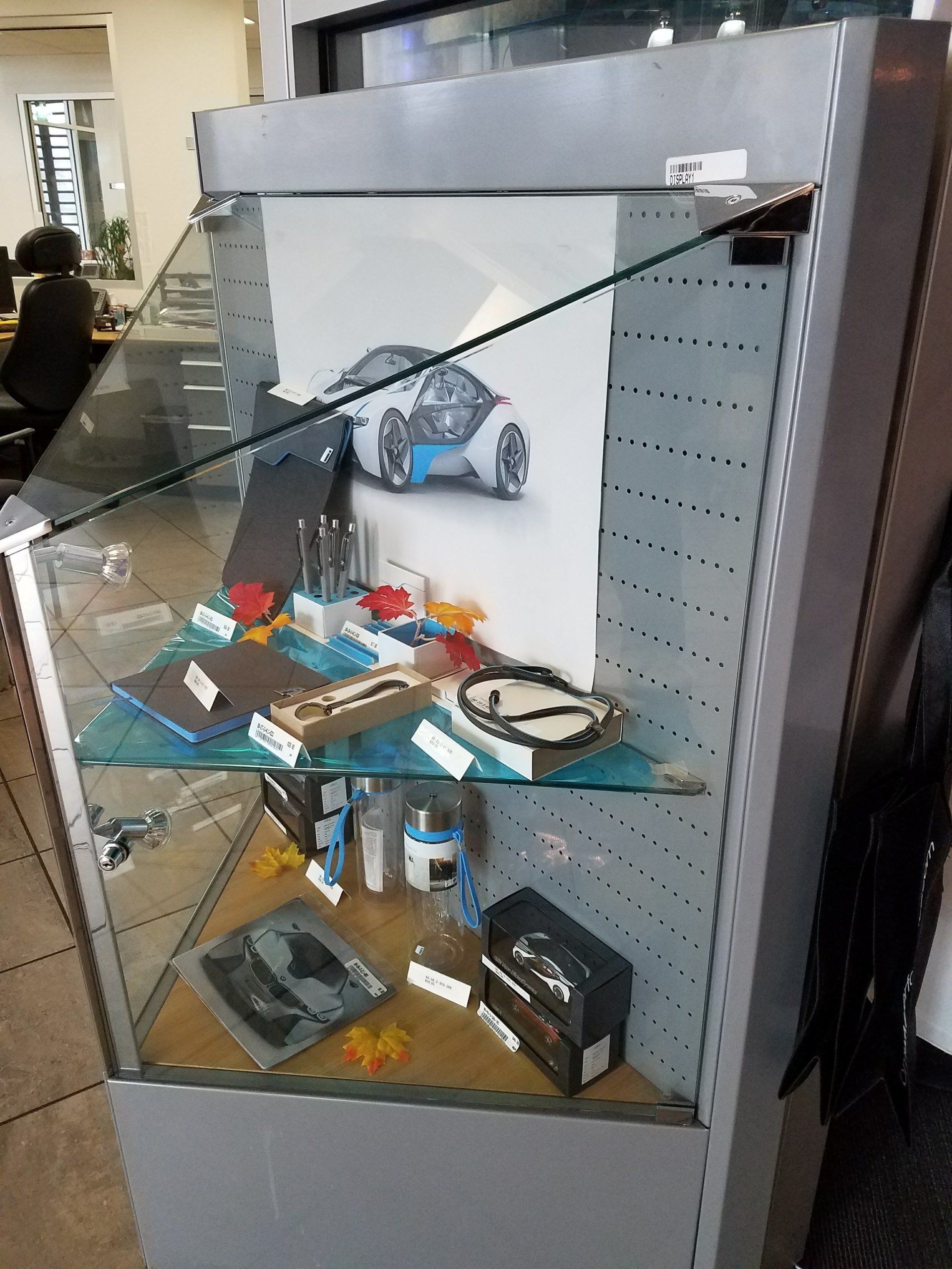 A display case with a picture of a car on it