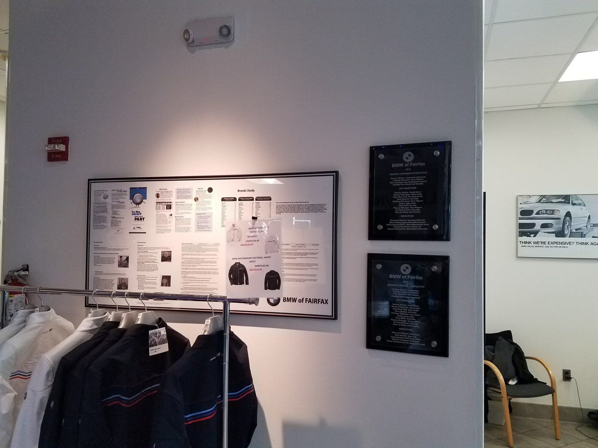A wall with a sign that says ' bmw ' on it