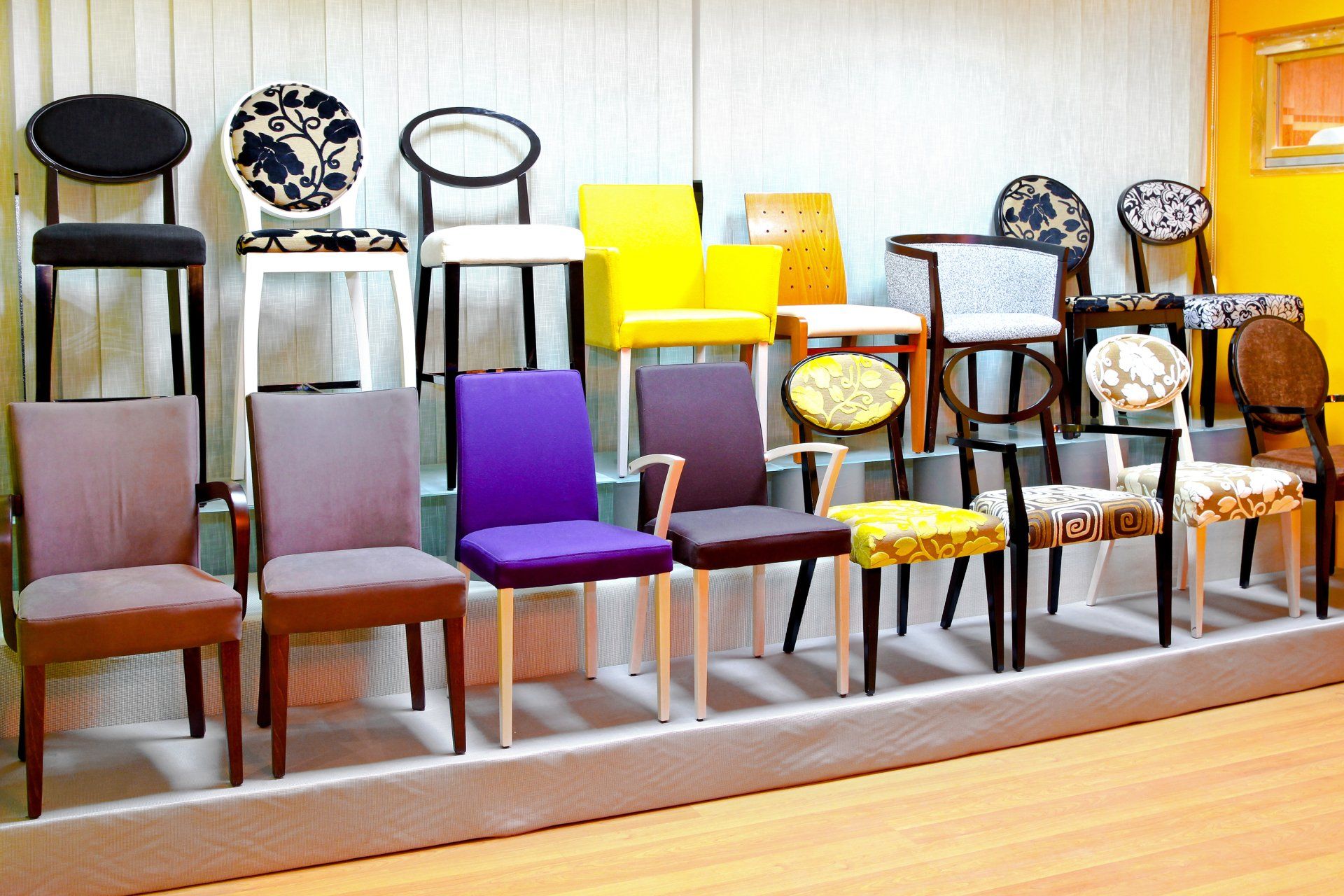 A bunch of chairs are lined up in a room