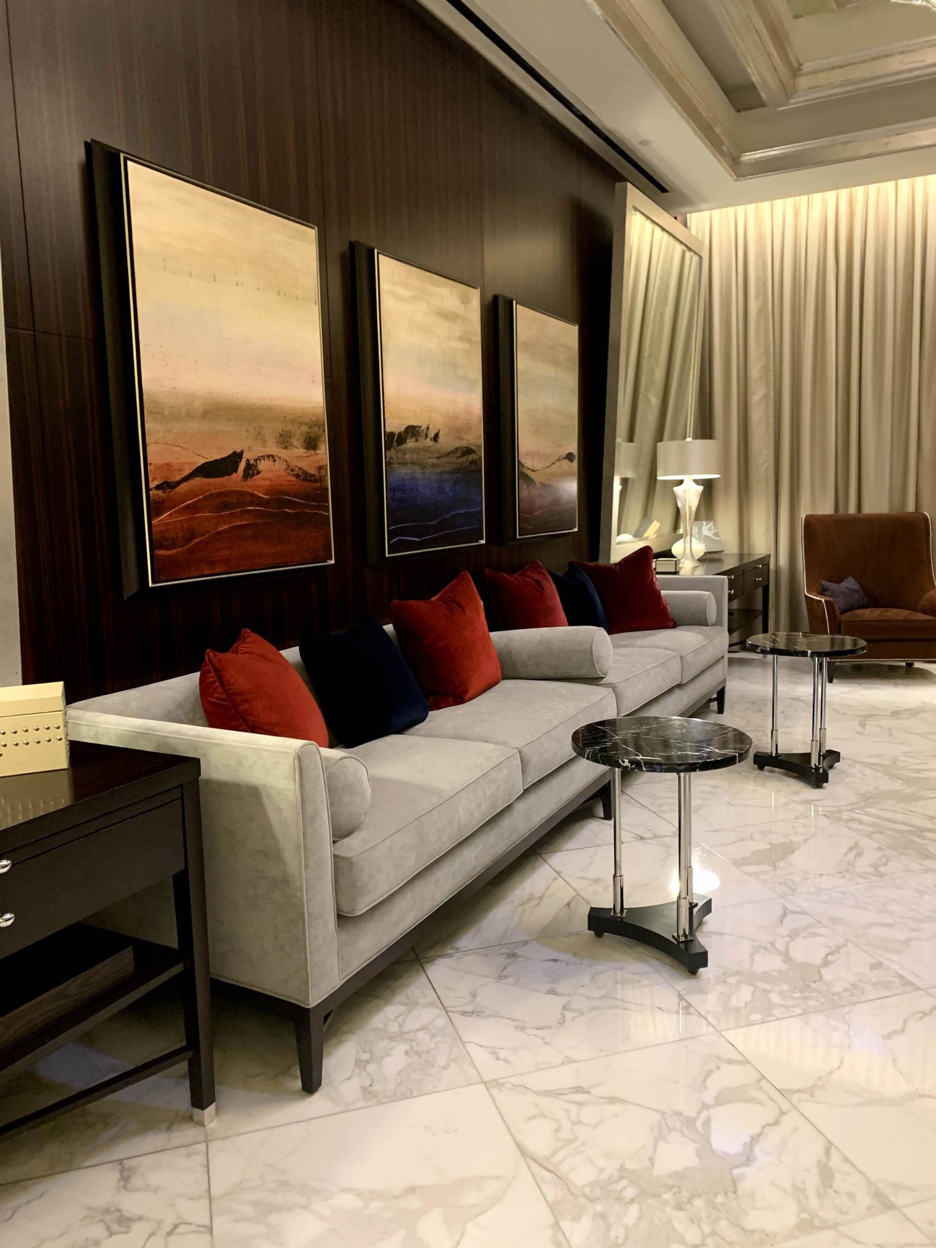 A living room with a couch and two tables