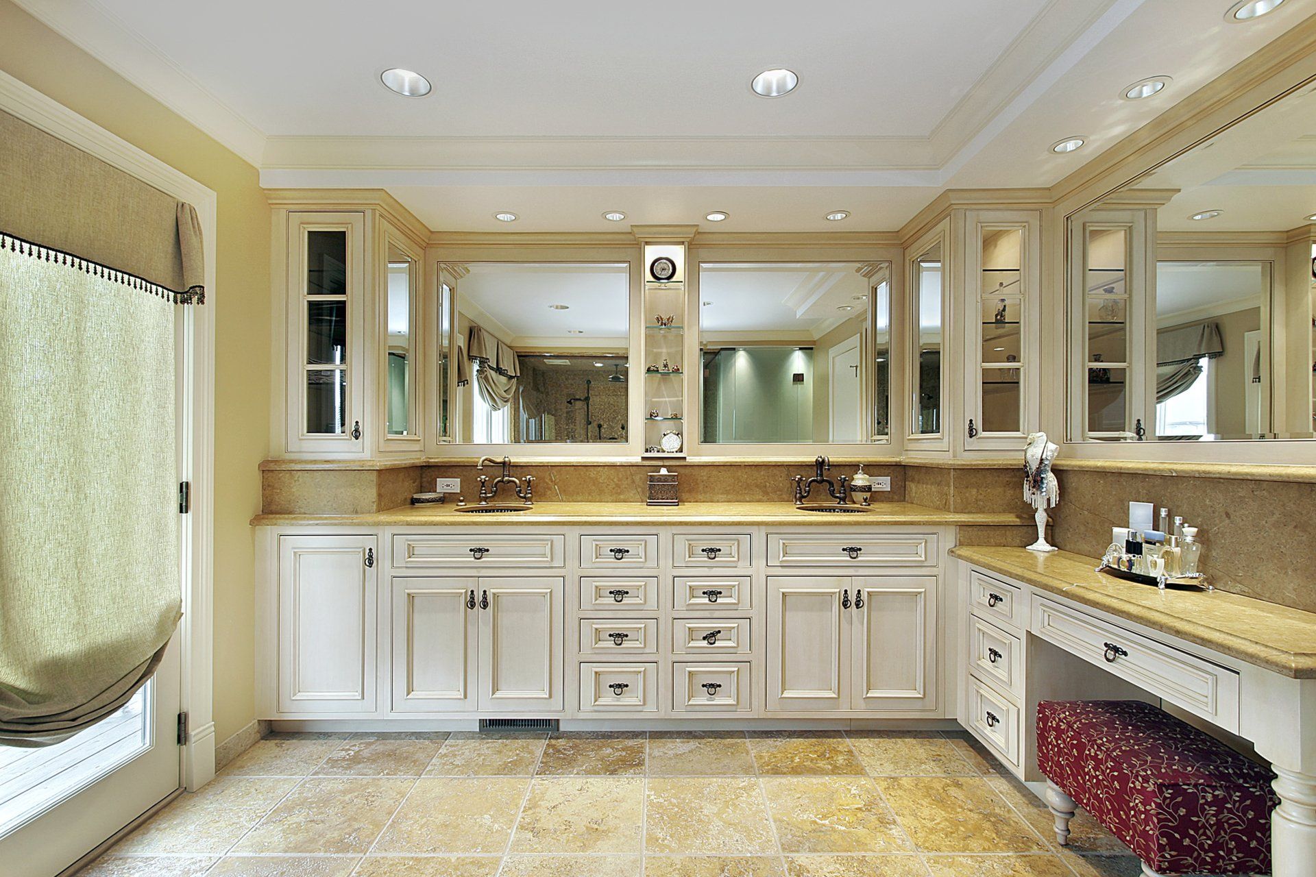 A bathroom with two sinks and two mirrors