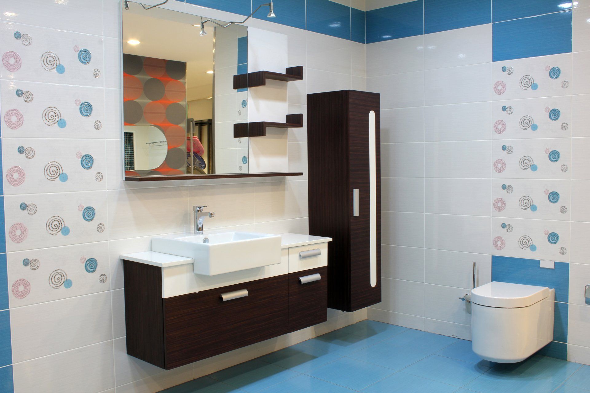 A bathroom with a sink , toilet and mirror