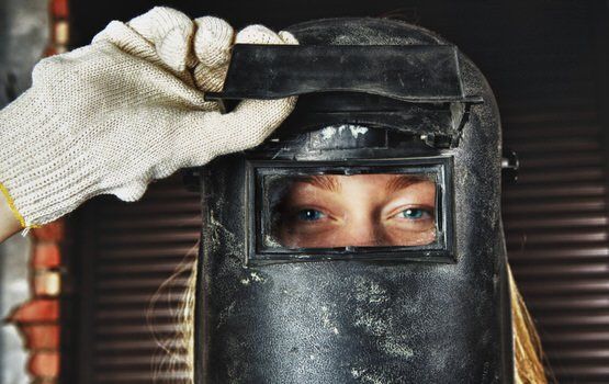 Young woman at her welding job in Toronto, Brampton, and Mississauga Ontario.