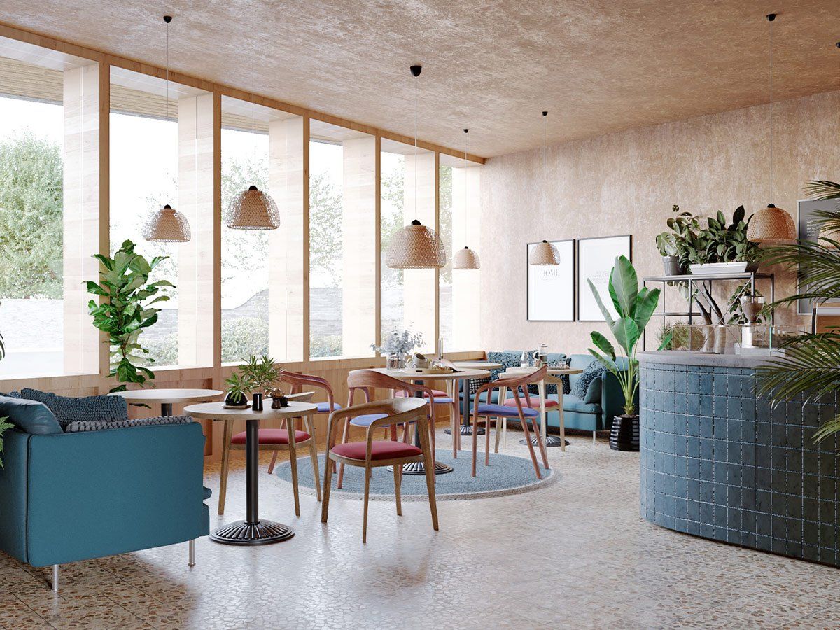 Bright modern cafe interior with wooden tables, plants, woven pendant lights, and a curved blue counter.