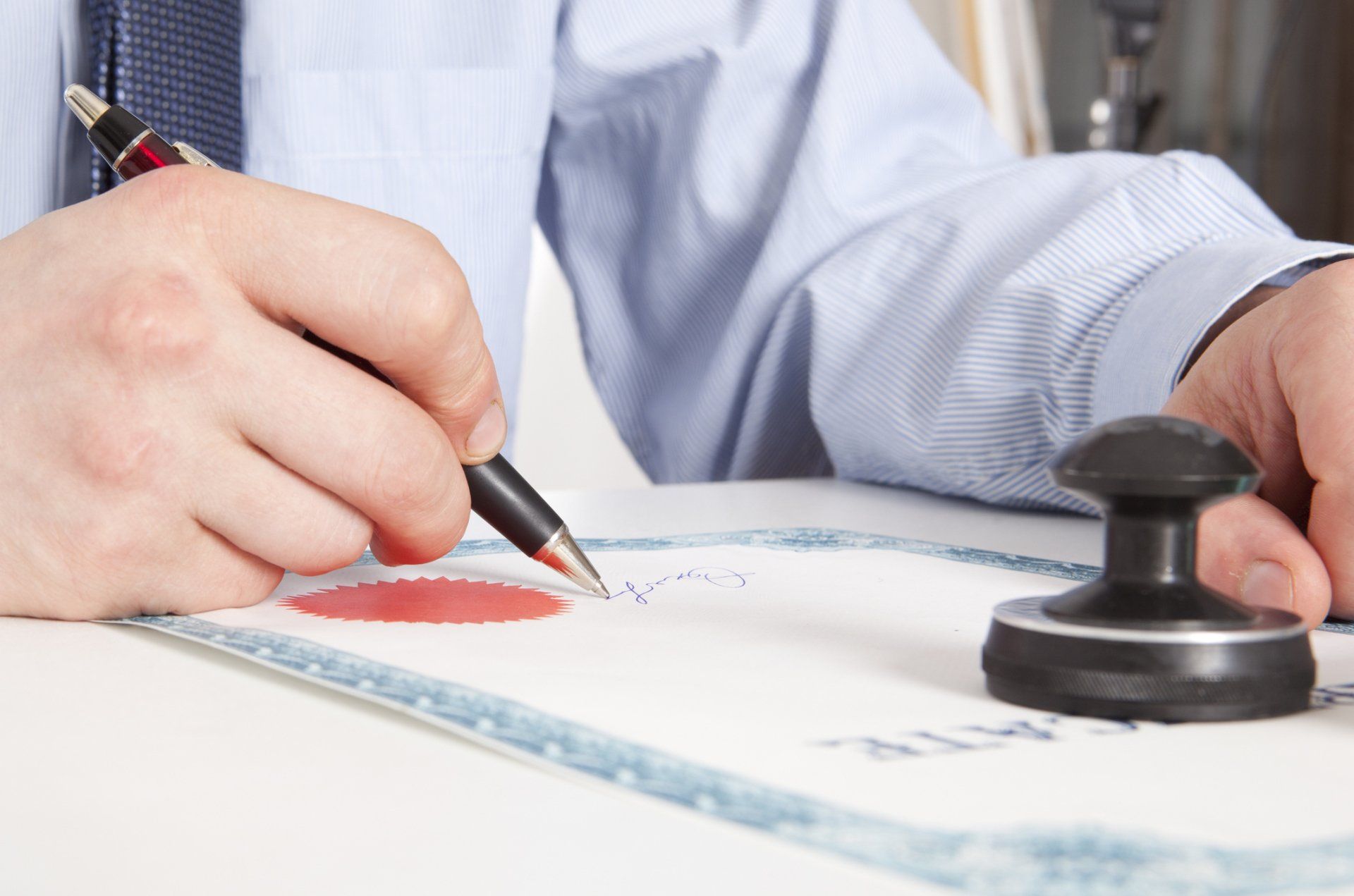 Man Signing a Paper - Escrow Company in Lakewood, CA Man Signing a Paper - Escrow Company in Lakewood, CA
