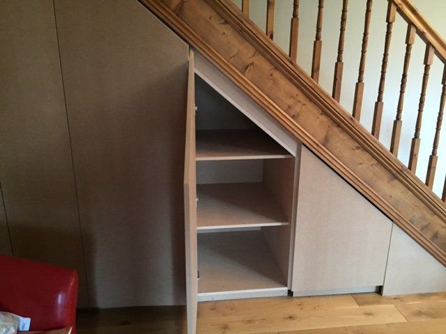 small staircase storage cupboard