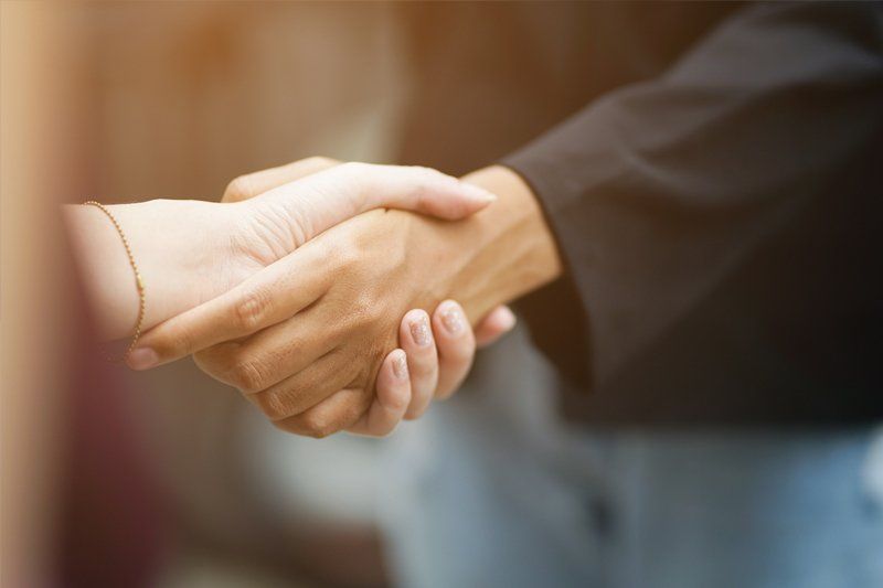 Shaking Hands with an Attorney — Roseville, CA — AmeriDiamond Legal Document Services Shaking Hands with an Attorney — Roseville, CA — AmeriDiamond Legal Document Services