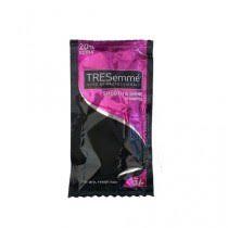 Un paquete de champú Tresemme, rosa y negro, con un 20% extra.