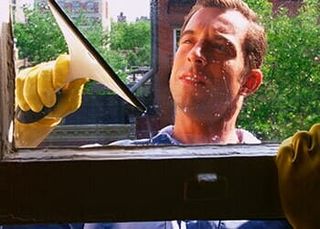 Window — Man Cleaning Exterior Window in Nashville, TN Window — Man Cleaning Exterior Window in Nashville, TN