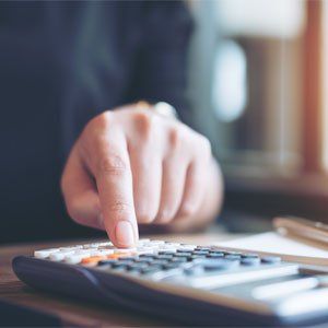 Tax Planning — A Business Woman Using Calculator in Hesperia, CA Tax Planning — A Business Woman Using Calculator in Hesperia, CA