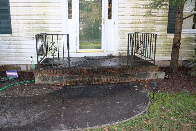 Pressure washing - Before (siding steps and walkway) - Maintenance Services in Kendall Park, NJ