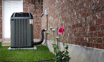 HVAC Contractor — Man Fixing Broken Air Condition in San Dimas, CA