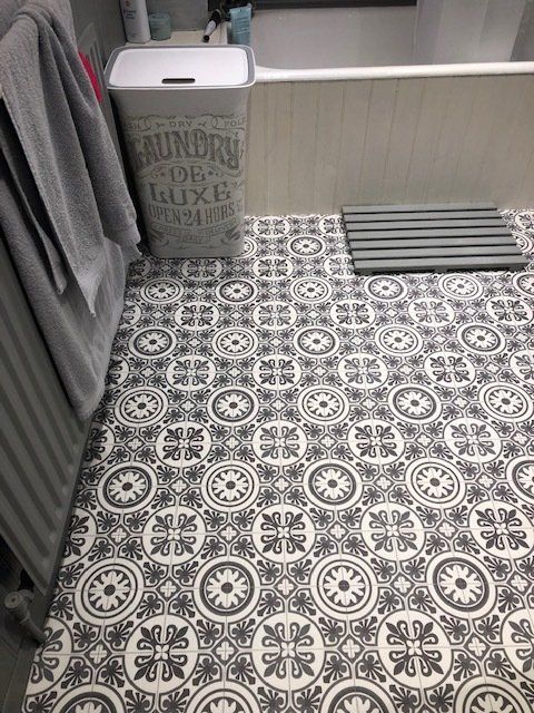 black white tiled vinyl flooring to bathroom