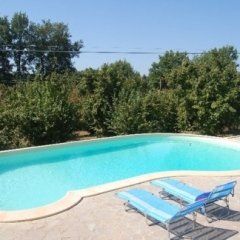 Swimming pool with deckchairs