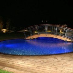 Swimming pool with bridge