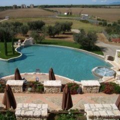 Garden of a hotel with swimming pool