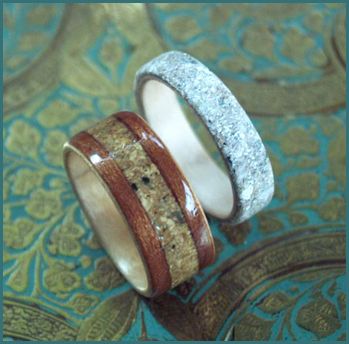 Wooden Memorial Rings inlaid with ashes of a beloved. Resting on a decorated box.