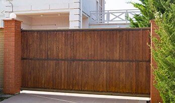 Garage Door — Brown Automatic Wooden Gate in Torrance, CA Garage Door — Brown Automatic Wooden Gate in Torrance, CA