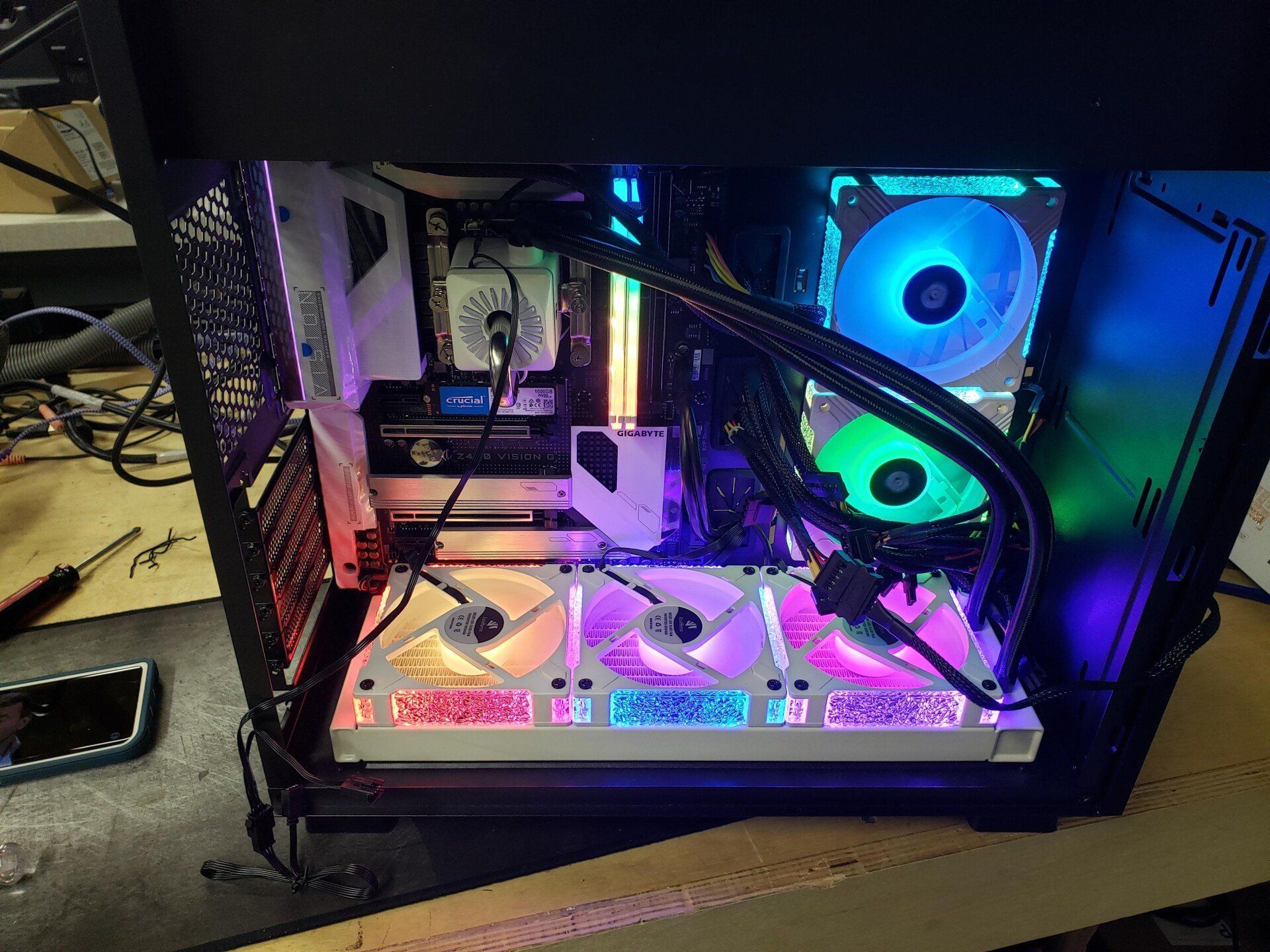 A computer case is sitting on top of a wooden table.