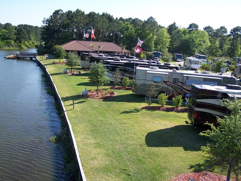 motorhomes on sites next to lake