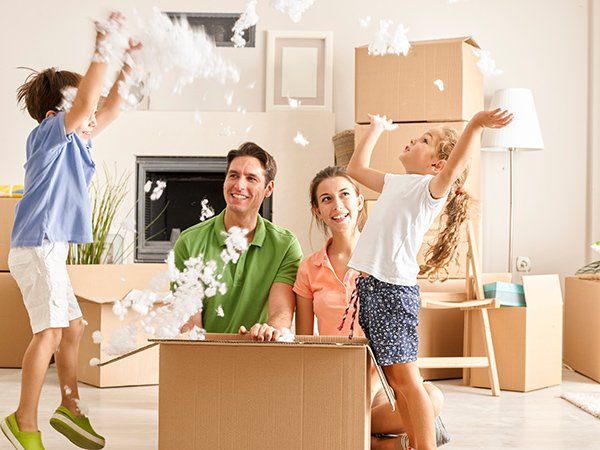 A family of four moves into a new home.