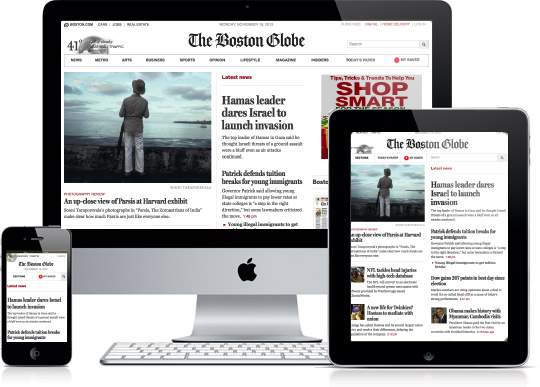 The boston globe is displayed on a computer tablet and phone