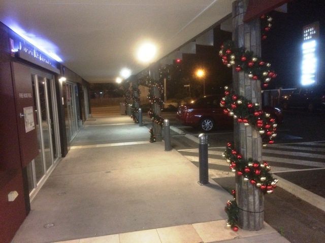 various Christmas decorations on pillars