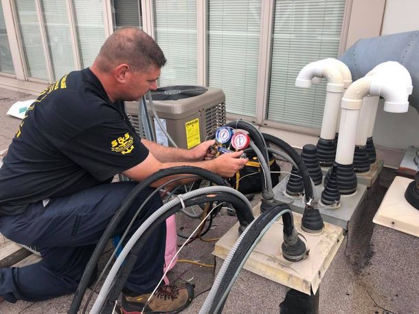 Man Fixing the Temperation — Moon Twp, PA — S & S Climate Systems LLC