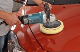 Waxing a red car